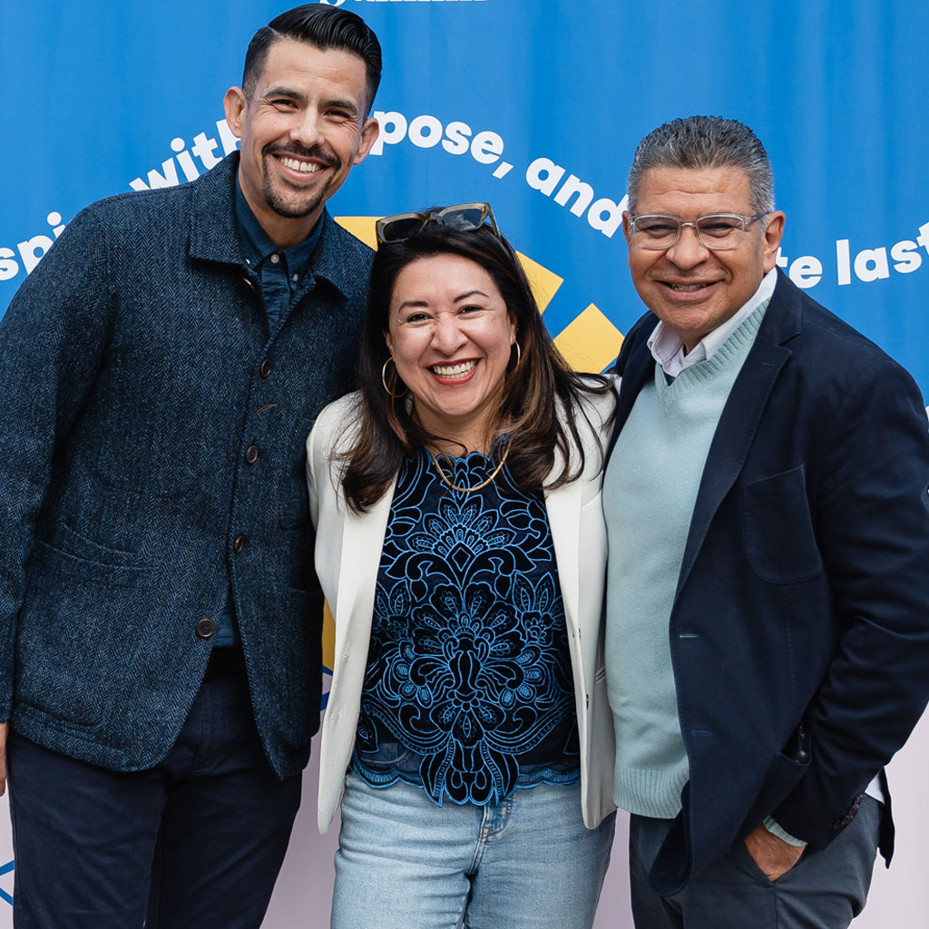 Local impact sector leaders posing for photos at a community event.